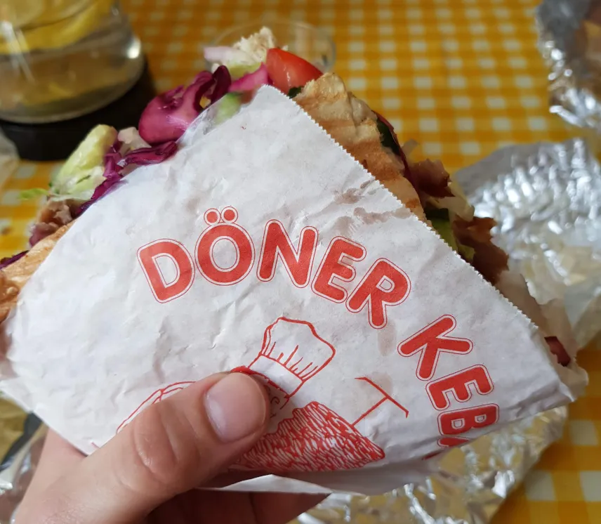 Picture of Philipp holding a Döner Kebab