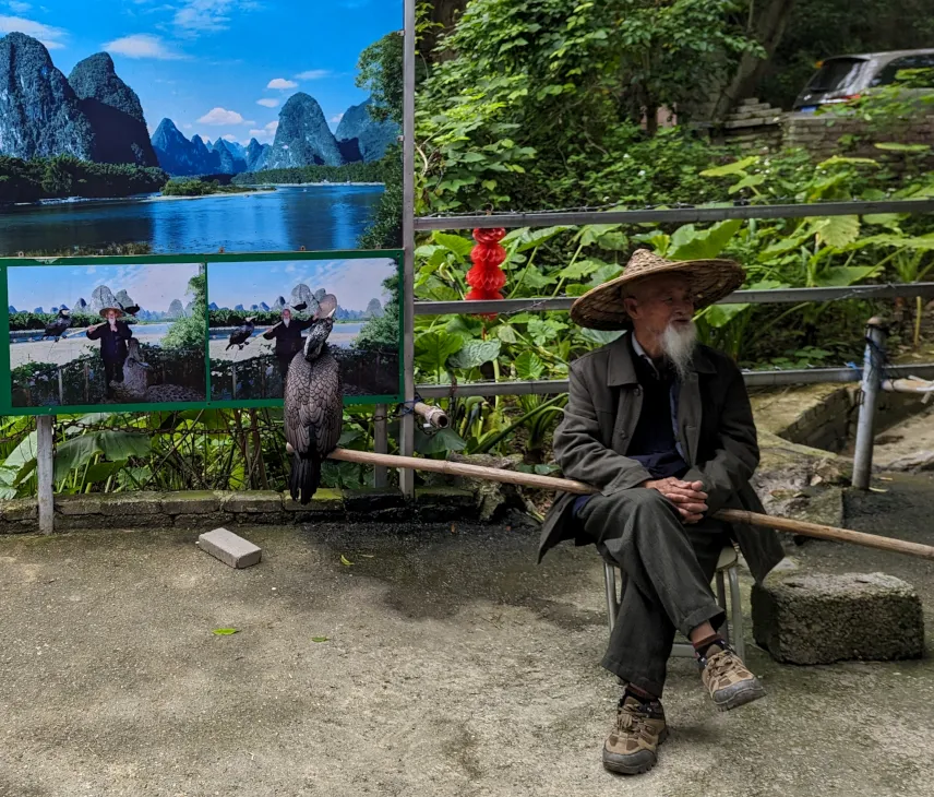 Picture of Model fisherman in Xingping waiting for his next photoshoot