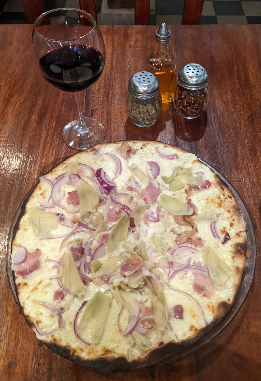 Picture of pizza and red wine in Nicaragua